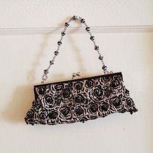 Decorative clutch with beads.